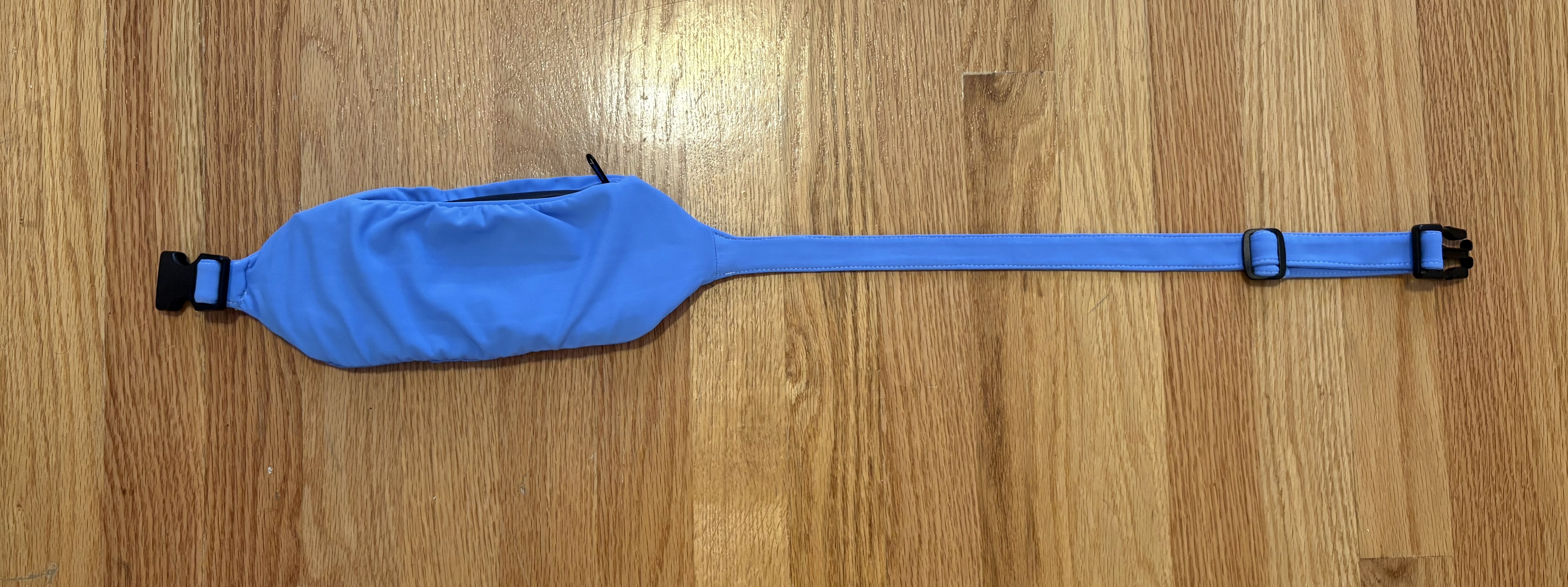Current SwapBelt prototype laid out on a wood floor